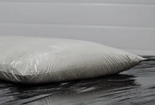 Crystalline admixture is packaged into a soluble bag