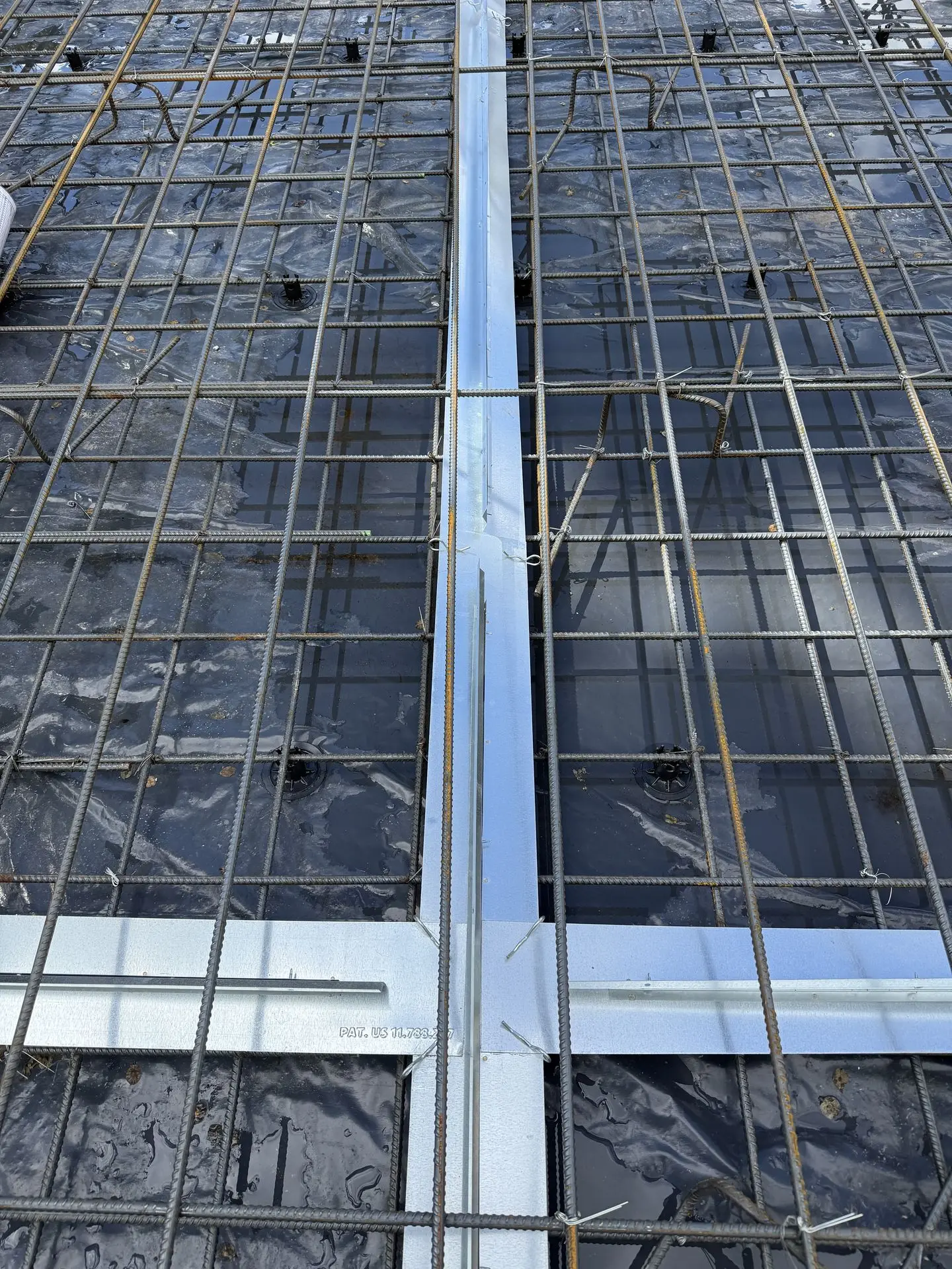 Patented Primostar® Crack Control System in the floor slab before the concrete is cast.