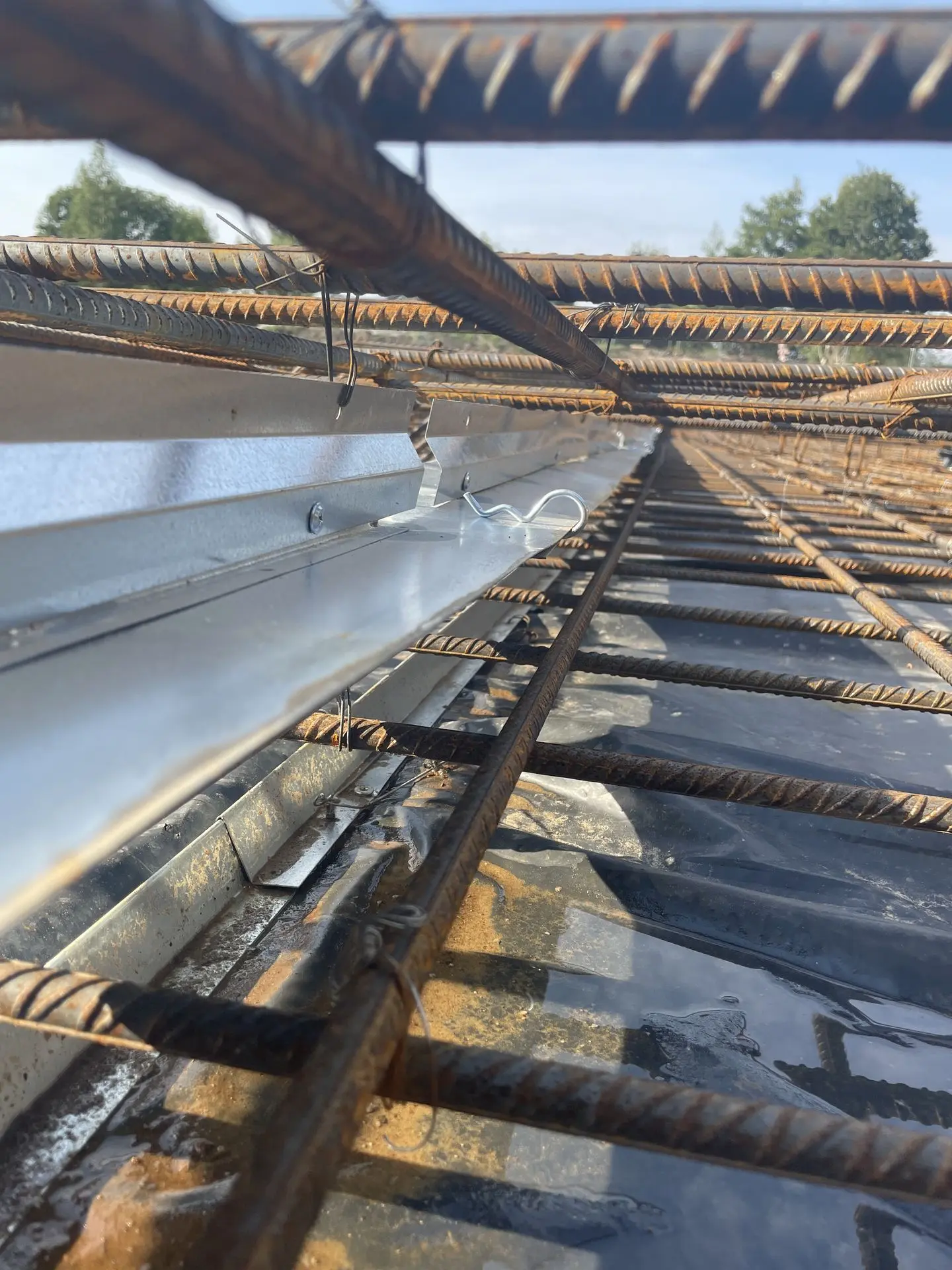 Patented Primostar® CRACK CONTROL SYSTEM (WPM® Crack Inducing Waterstop) in floor construction slab before concrete pouring (cast). Object Marati Quarter, Kopli, Tallinn.