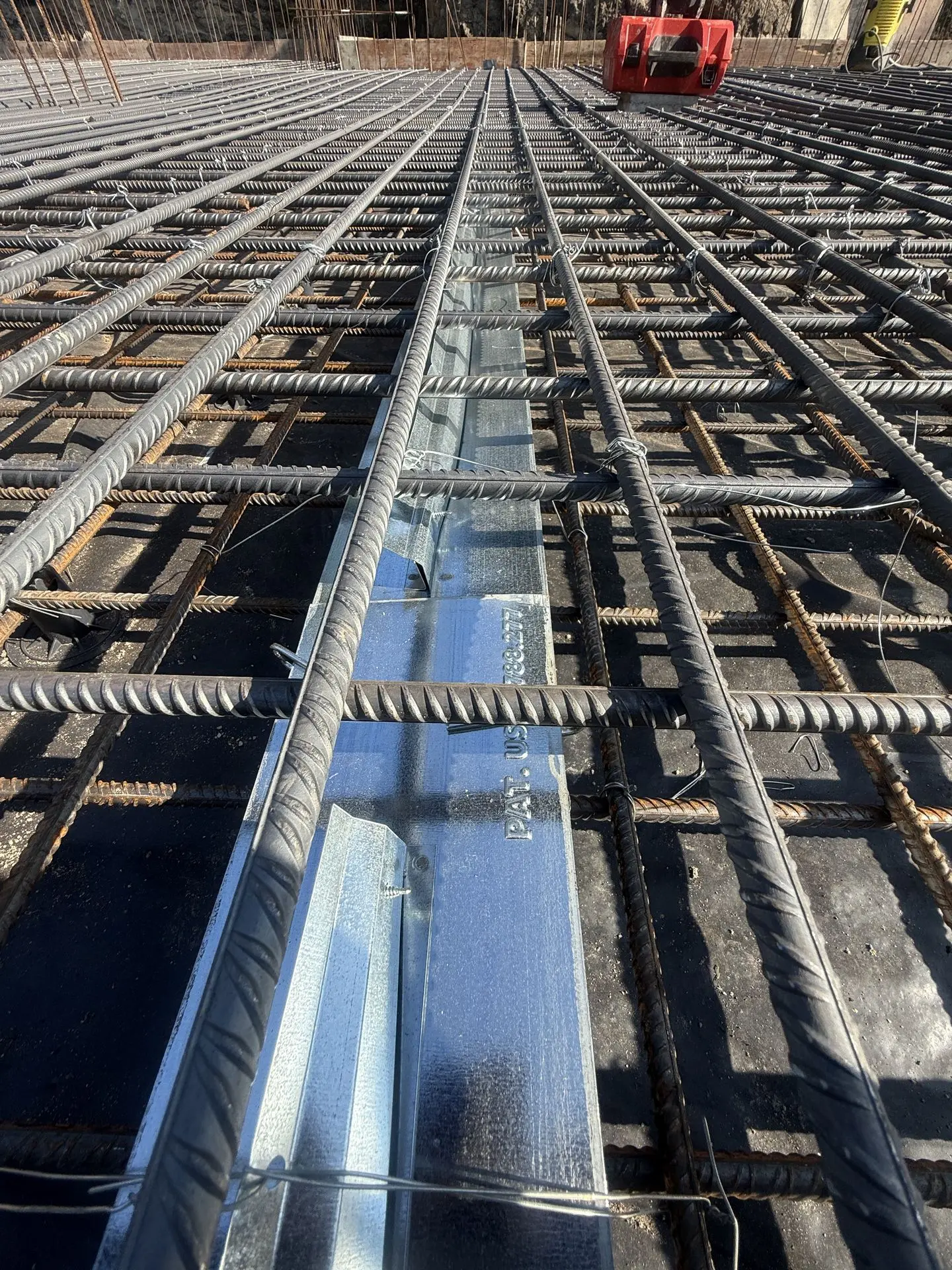 Patented Primostar® CRACK CONTROL SYSTEM (WPM® Crack Inducing Waterstop) in floor construction slab before concrete pouring (cast). Object Sprdi 3A/3B, Kritiine, Tallinn, Estonia.