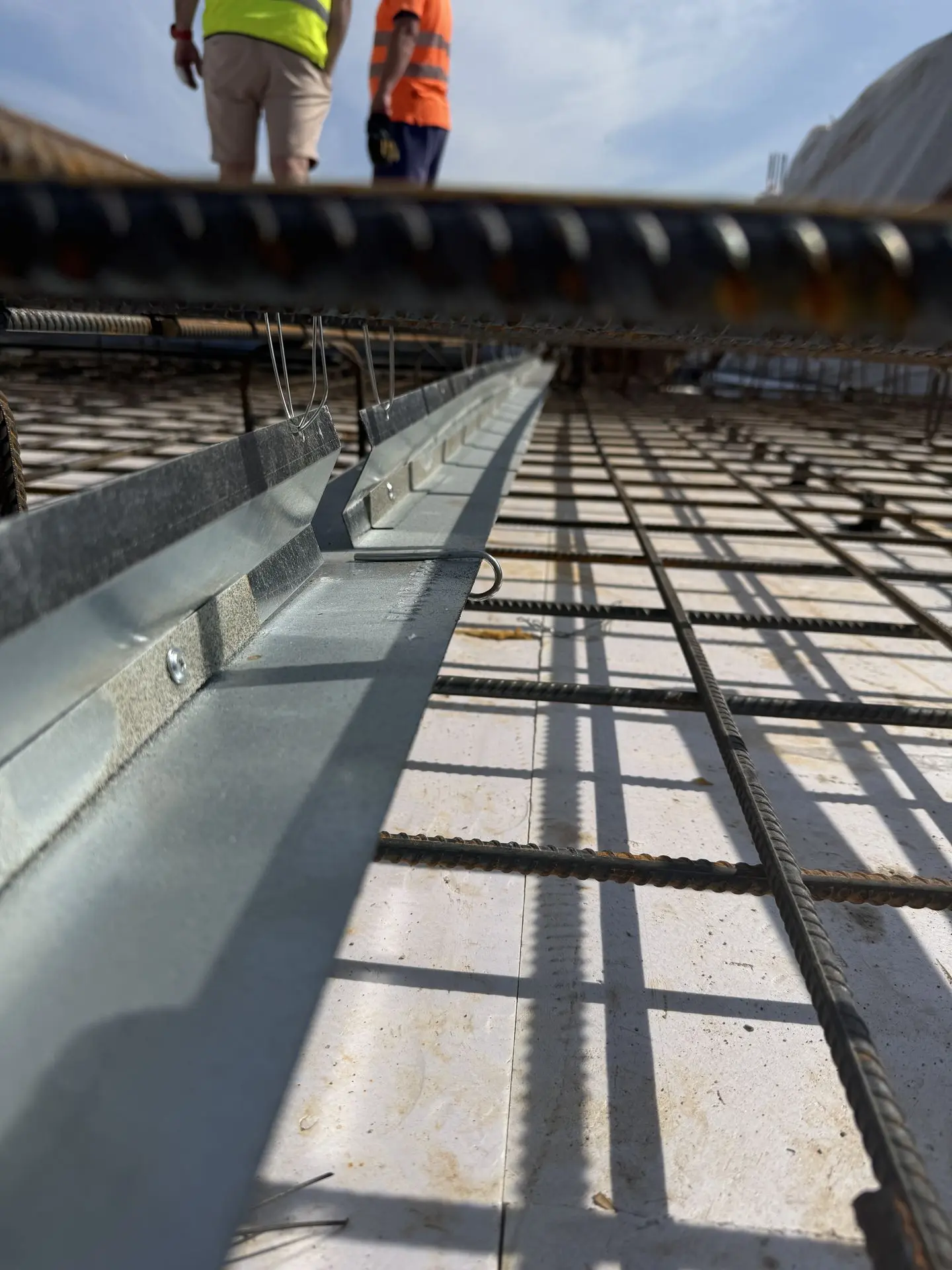 Patented Primostar® Crack Control System installed before concrete pouring. Installation takes place within the floor slab, between the reinforcement bars. Haapsalu, Estonia