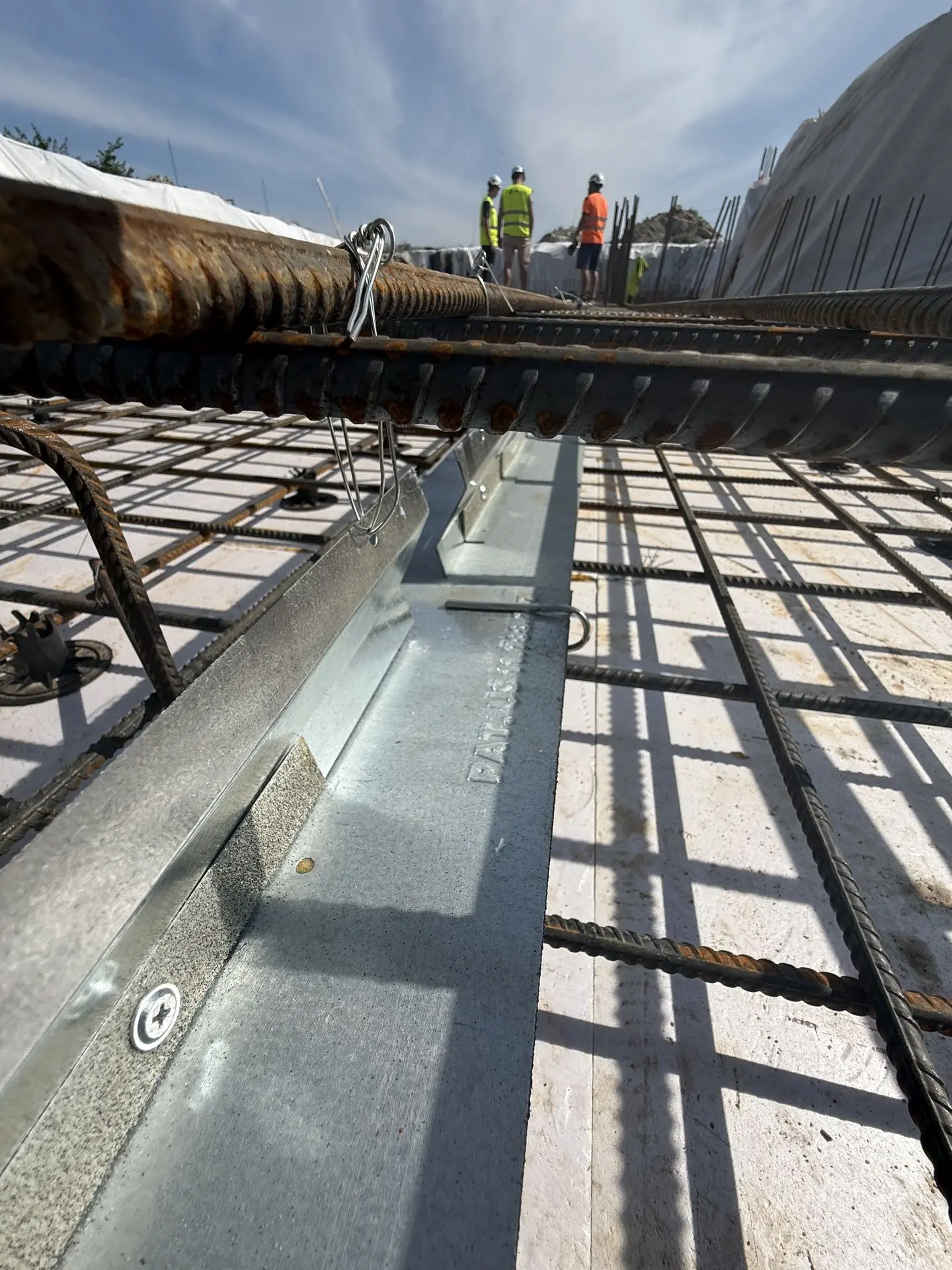 Patented Primostar® Crack Control System installed before concrete pouring. Installation takes place within the floor slab, between the reinforcement bars. Haapsalu, Estonia