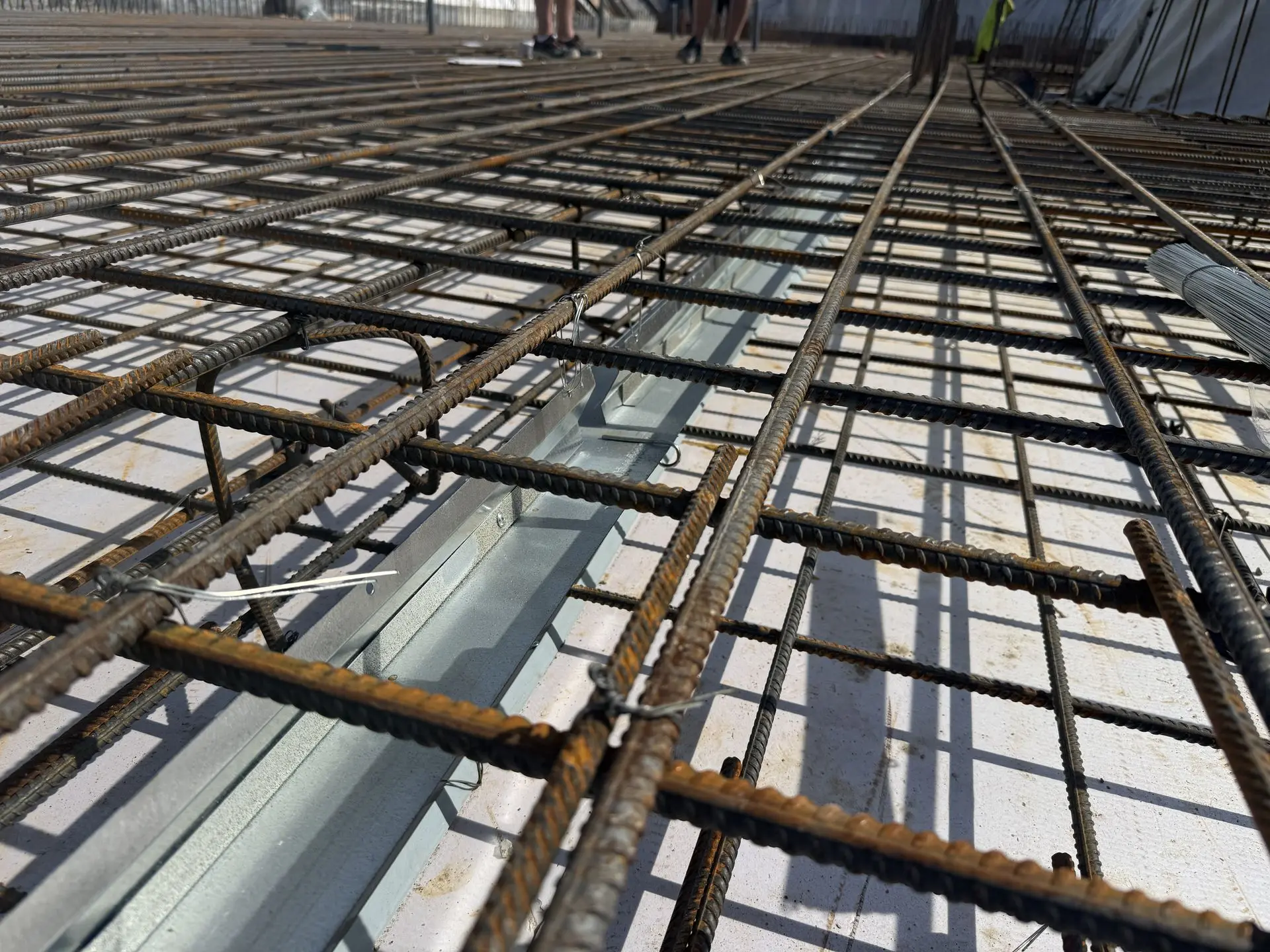 Patented Primostar® Crack Control System installed before concrete pouring. Installation takes place within the floor slab, between the reinforcement bars. Haapsalu, Estonia